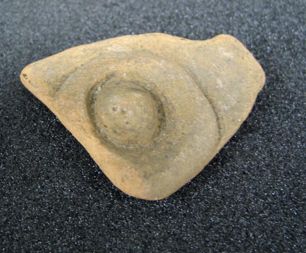 sherd, with applied decoration, part of a vessel